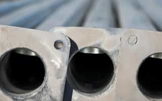 Galvanized poles in various applications: streetlights, power lines, communication towers